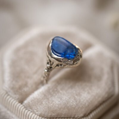 An Australian opal ring featuring a natural opal with an intense blue play of light.