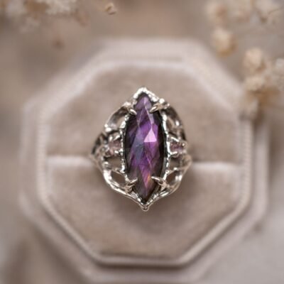 Faceted purple labradorite in a silver openwork setting
